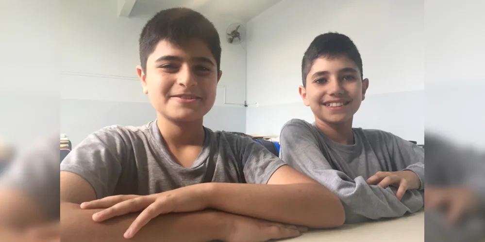 Eili Al Housh, 12 anos, e Daniel Al Saad, 11 anos, deixaram a cidade de Damasco, na Síria, fugindo da guerra civil, e vieram ao Brasil em busca de um recomeço