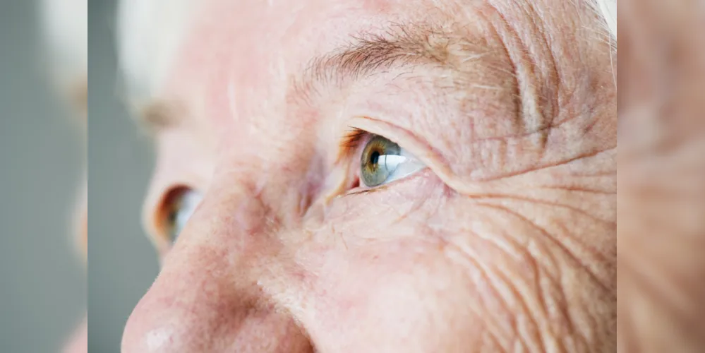 Closeup side portrait of white elderly woman&#39;s eyes